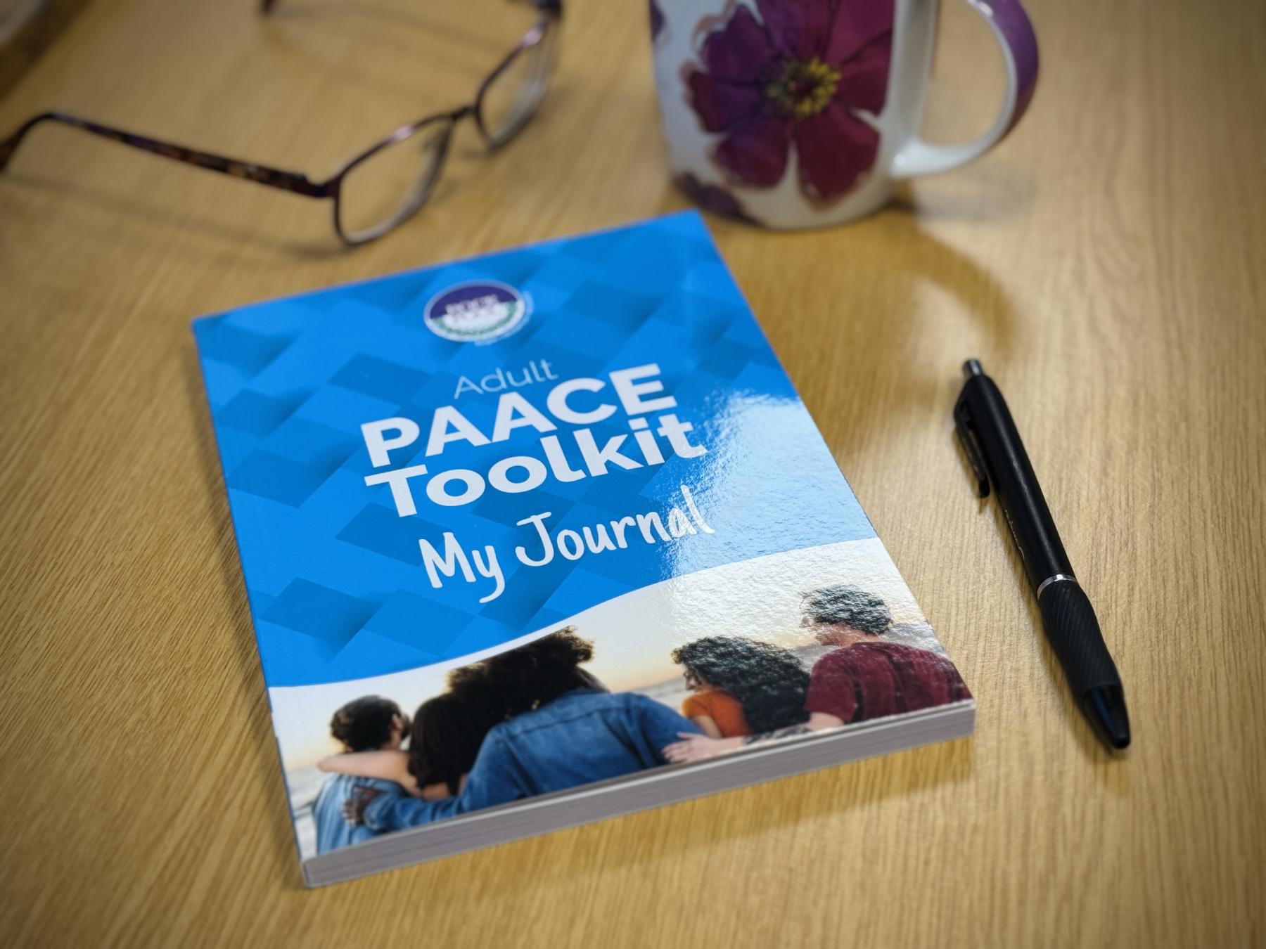 PAACE jjournal on desk